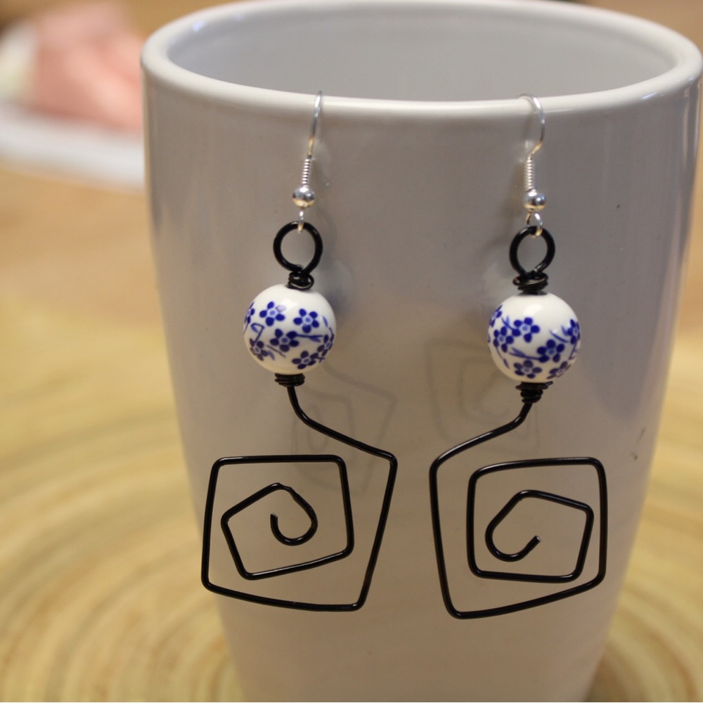 Hand made wire earrings, white ball with blue flowers